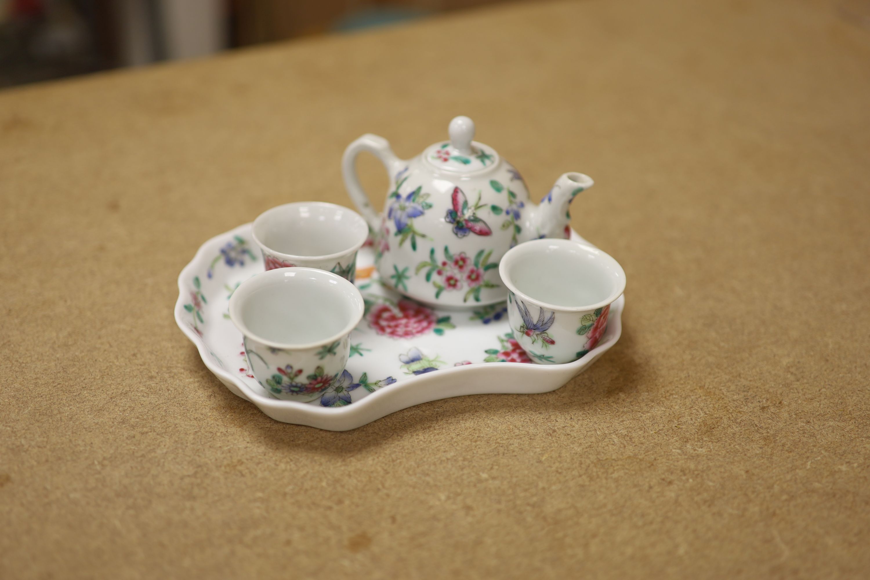A Chinese Famille Rose miniature tea set with tray, length 18cm